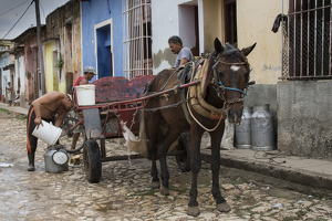Collecting garbage, Trinidad, Cuba - Photo by Nancy Schumann