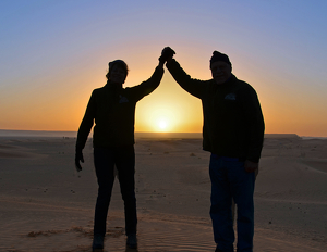 Saluting A Sahara Sunrise - Photo by Louis Arthur Norton