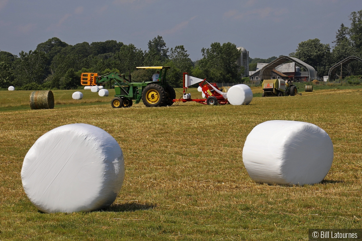 Bailing And Wrapping Hay by Bill Latournes