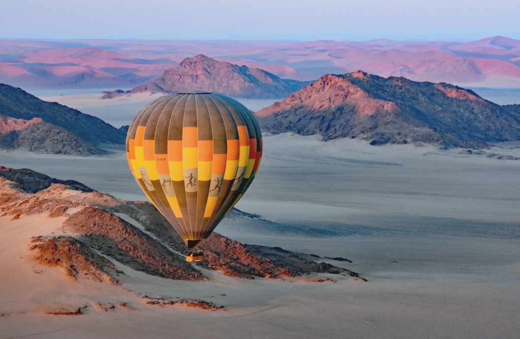 Balloon at Dawn over the Pink Dunes Of Namib-Naukluft National Park, Namibia by Susan Case