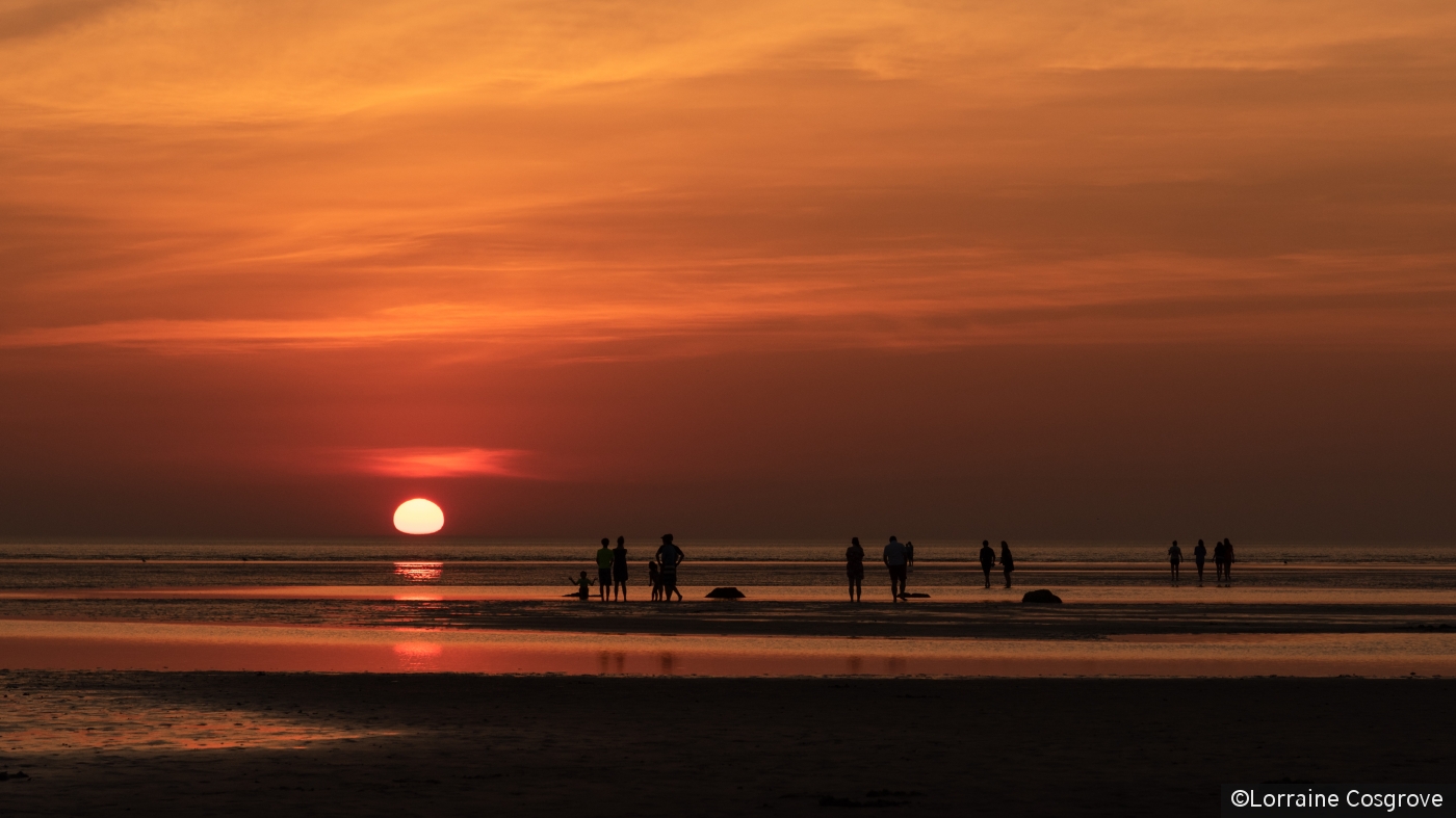 Enjoying the Sunset  at Skaket Beach by Lorraine Cosgrove