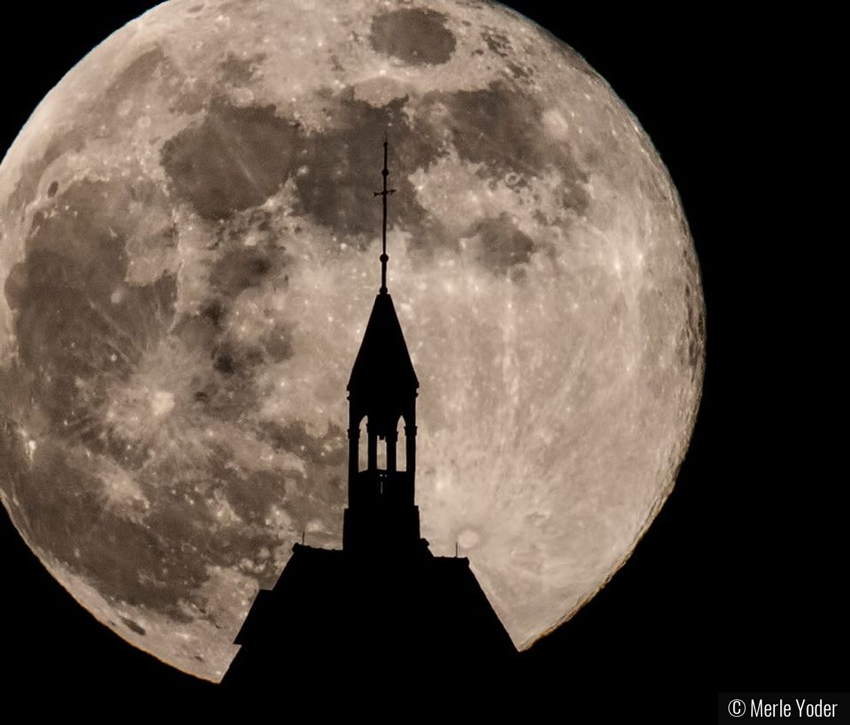 Full moon rising behind Heublein Tower by Merle Yoder