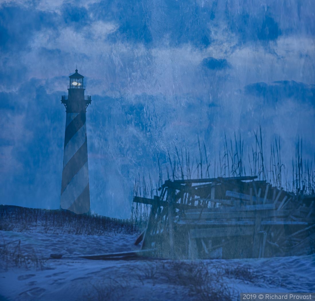 Hatteras light house through clouds by Richard Provost