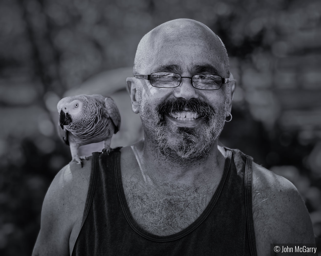 Man with Gray Parrot by John McGarry