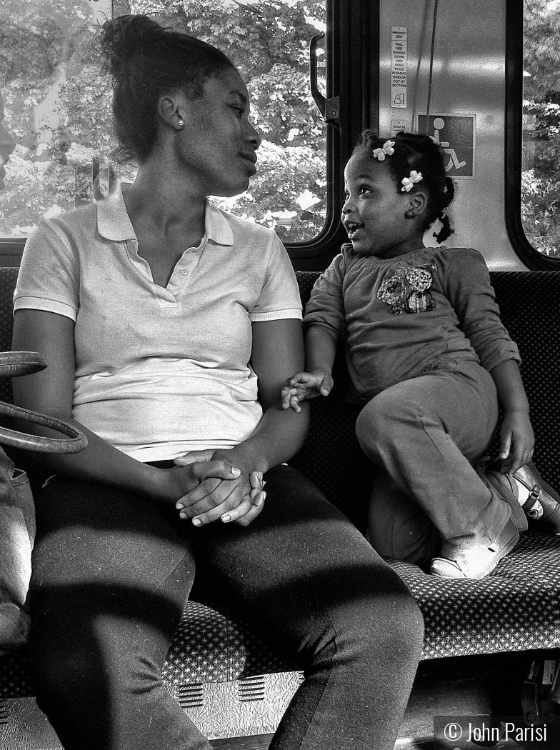 Mom and daughter on the bus Hartford by John Parisi