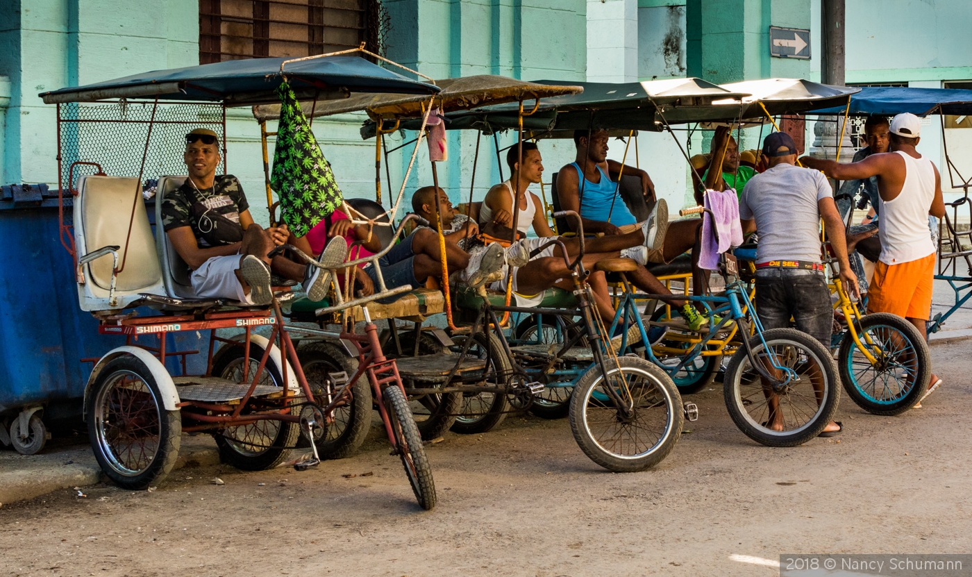 Pedicab Drivers, Havana, Cuba by Nancy Schumann