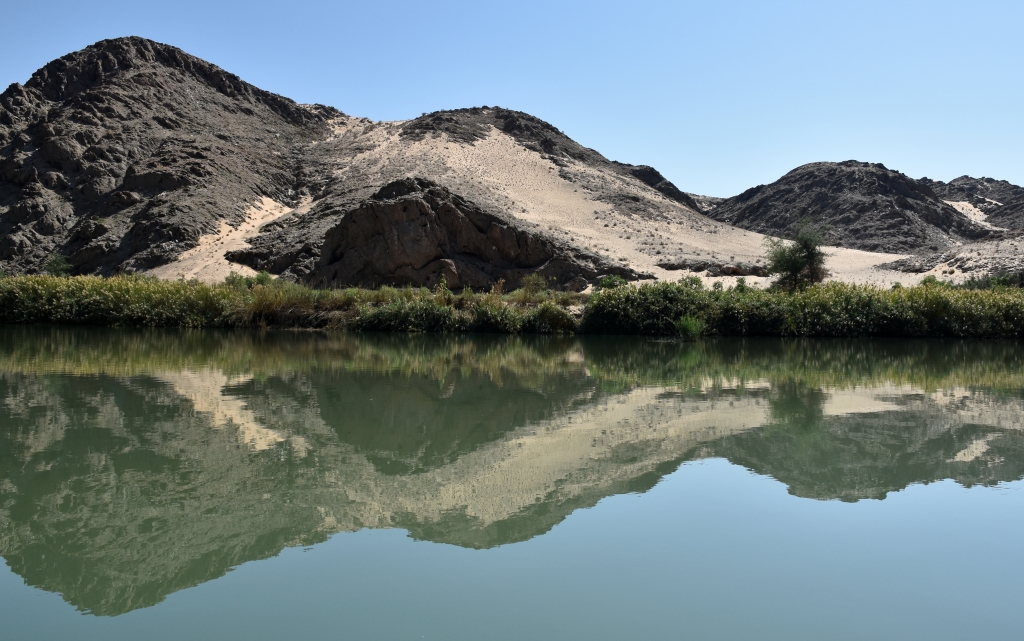Serenity - Angolan Landscape Reflected In The Kunene River Namibia by Susan Case