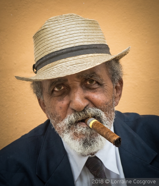 Smoking a Cuban Cigar by Lorraine Cosgrove