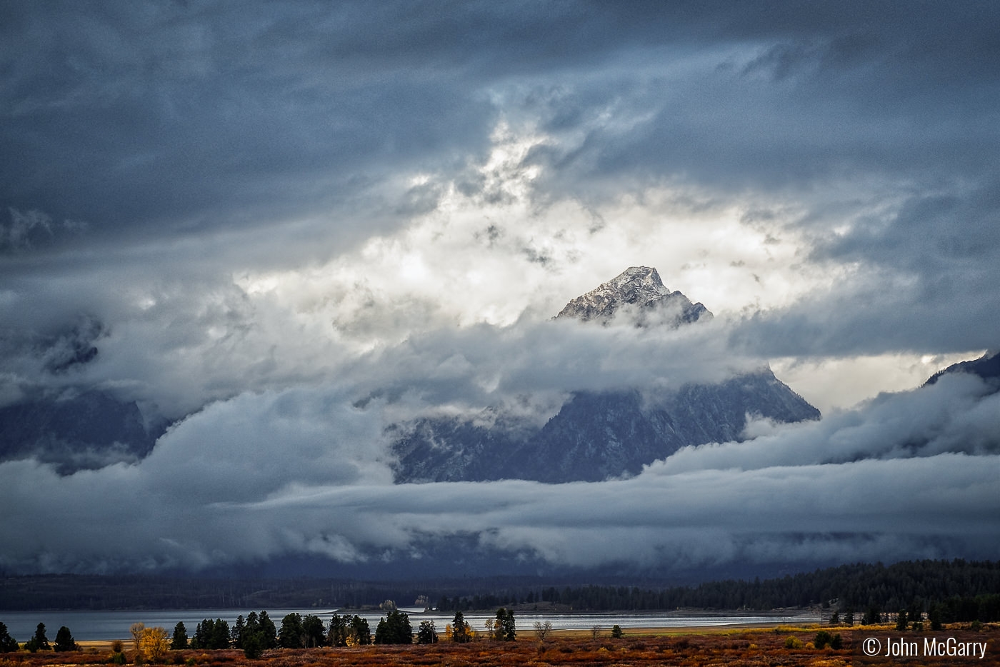 Sunlit Peak Grand Tetons by John McGarry