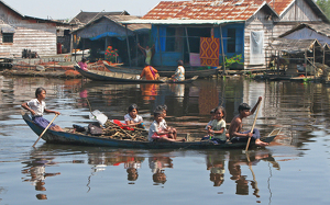 Class A 2nd: Cambodian Lake-children Paddle To School by Lou Norton