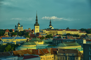 Class A HM: Dawnn Reflected Off The Tallinn Estonia Roof Tops by Lou Norton