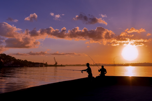 Fishing on the Malecon at Sunrise - Photo by Lorraine Cosgrove