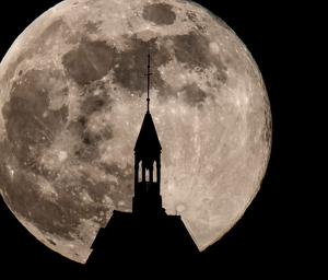 Full moon rising behind Heublein Tower - Photo by Merle Yoder