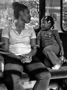 Mom and daughter on the bus Hartford - Photo by John Parisi