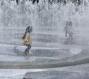 Playing in the Fountain - Photo by Alene Galin