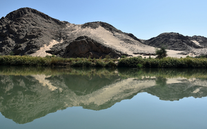 Serenity - Angolan Landscape Reflected In The Kunene River Namibia - Photo by Susan Case