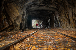 Two Travelers Trekking Through the Tunnel - Photo by Bill Payne